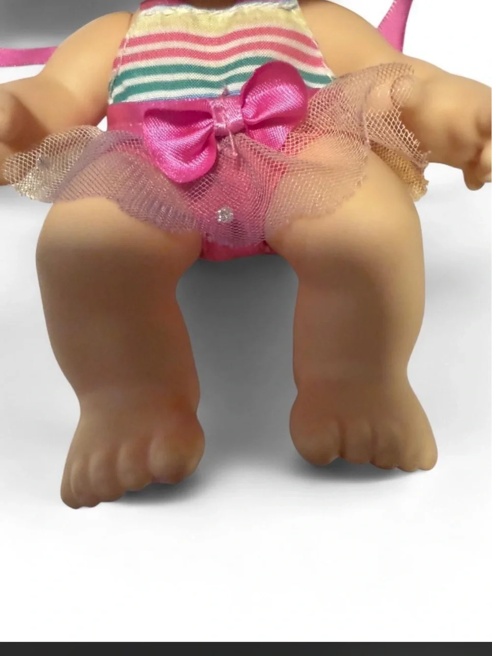 Moose Toys Kindi Kids Scented Sister Cutie Cake doll with a light blue pacifier